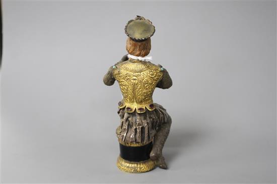 An Austro-Hungarian gilt and white metal figure of a seated knight, with jewelled decoration and hardwood head, height 11.5cm